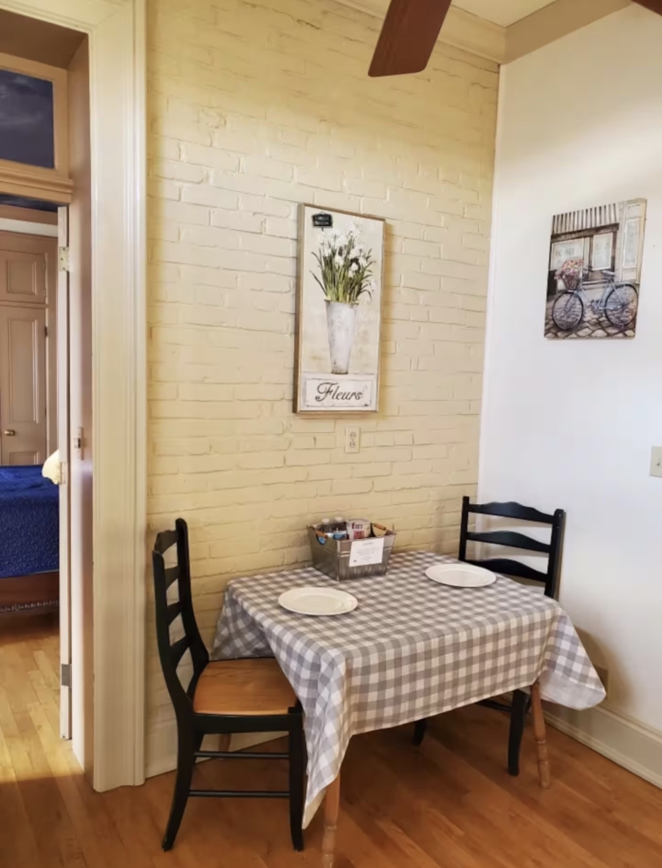 Charming dining nook with brick walls
