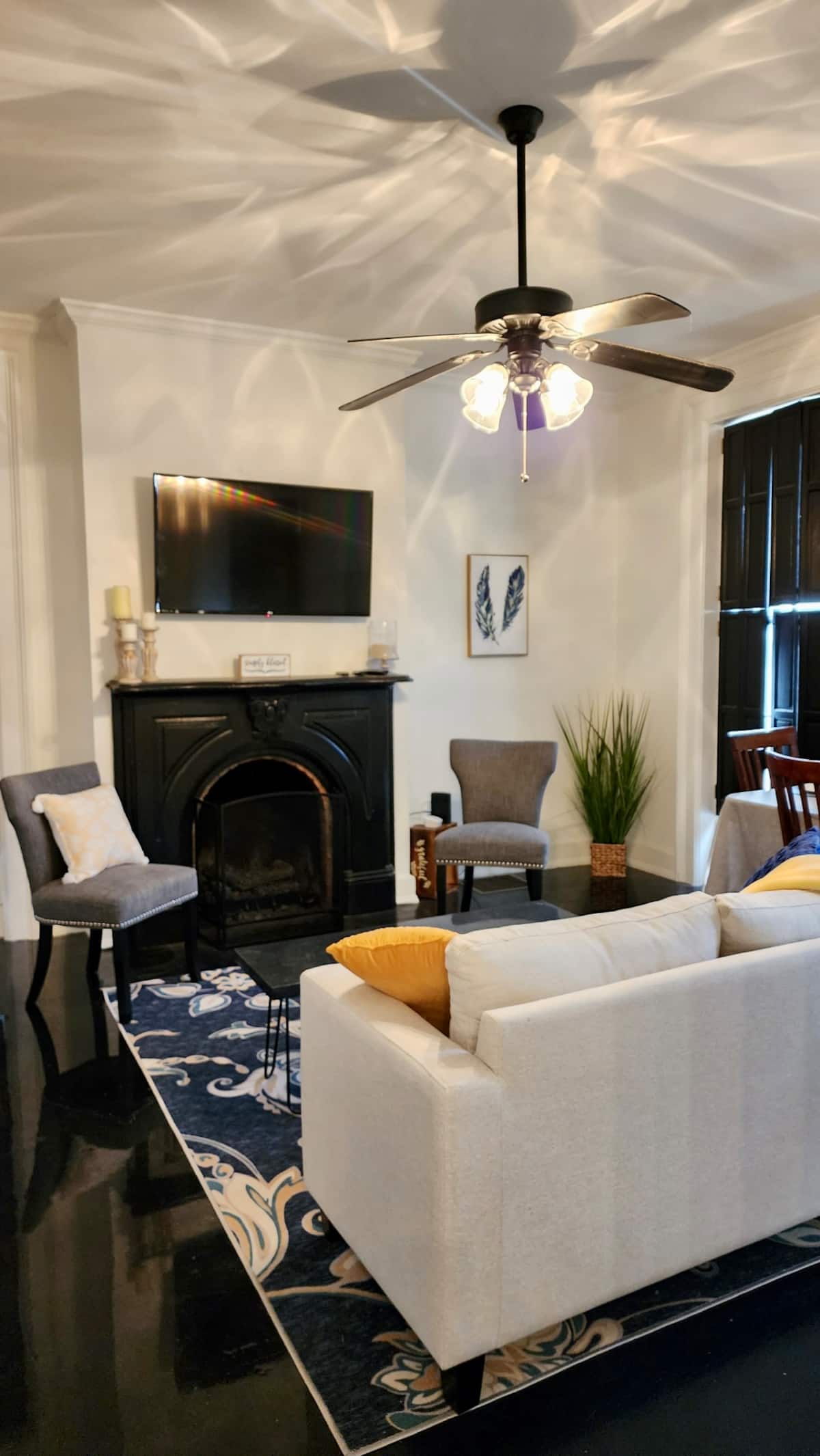 Living room with fireplace and TV